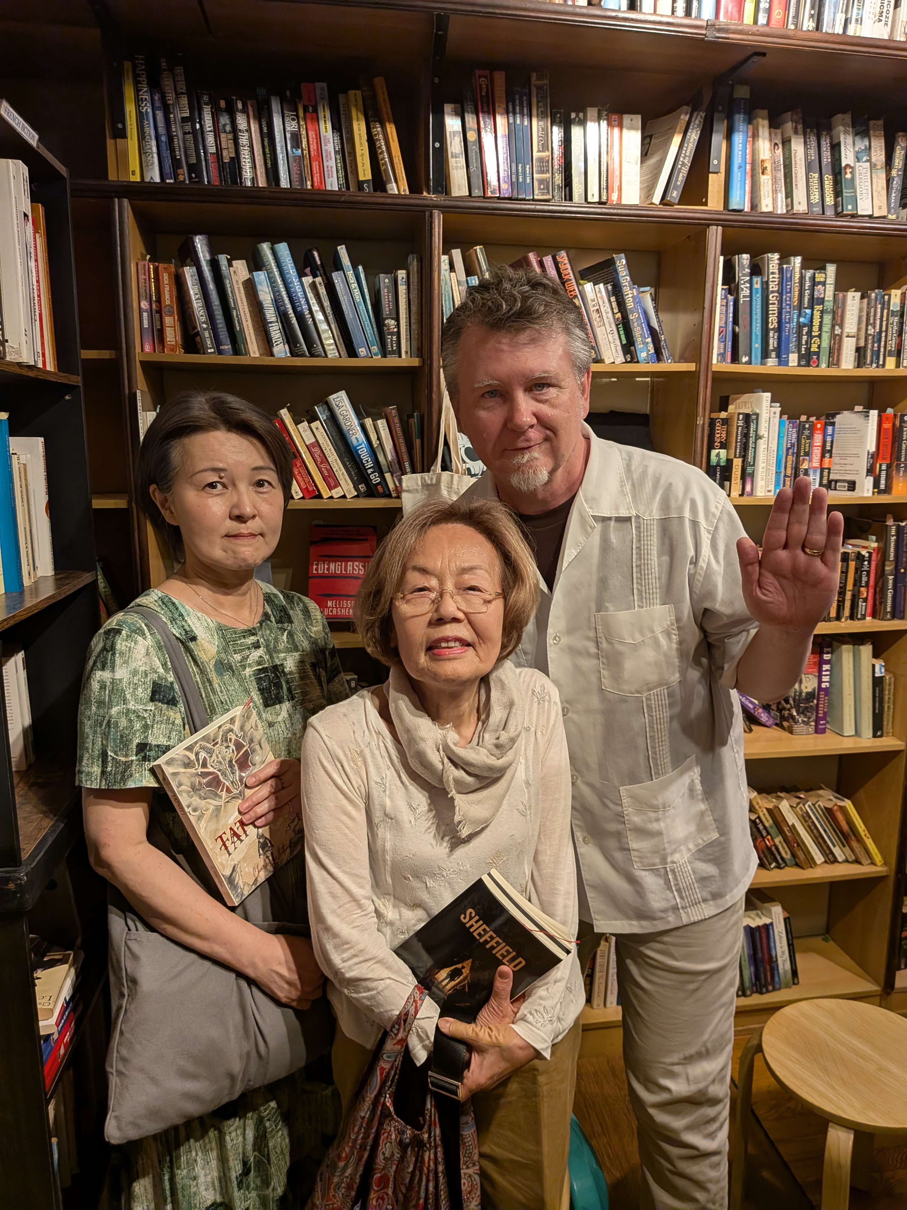Charles with both readers named Masako, each holding one of his books
